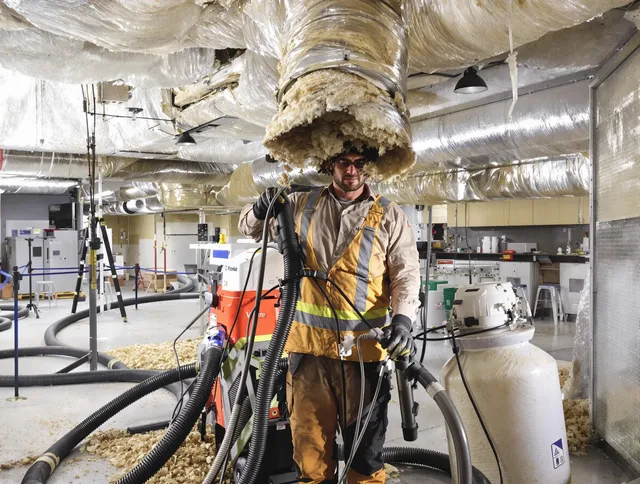 Professional vacuum insulation removal by Wilmington Air Duct Cleaning expert in Wilmington